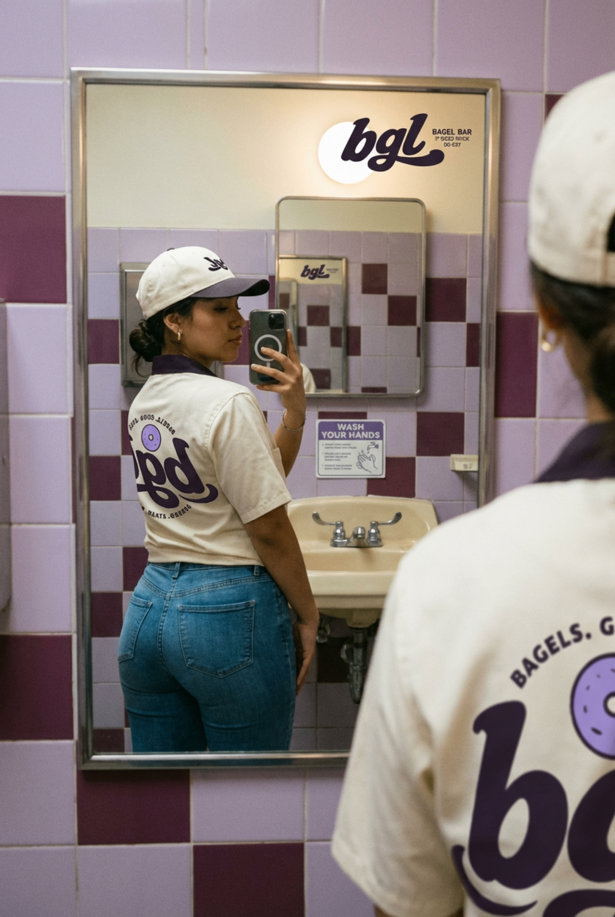 bgl staff uniform — cap and tee in bathroom mirror
